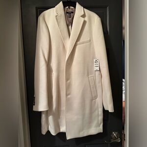 Men’s cream mid length coat.